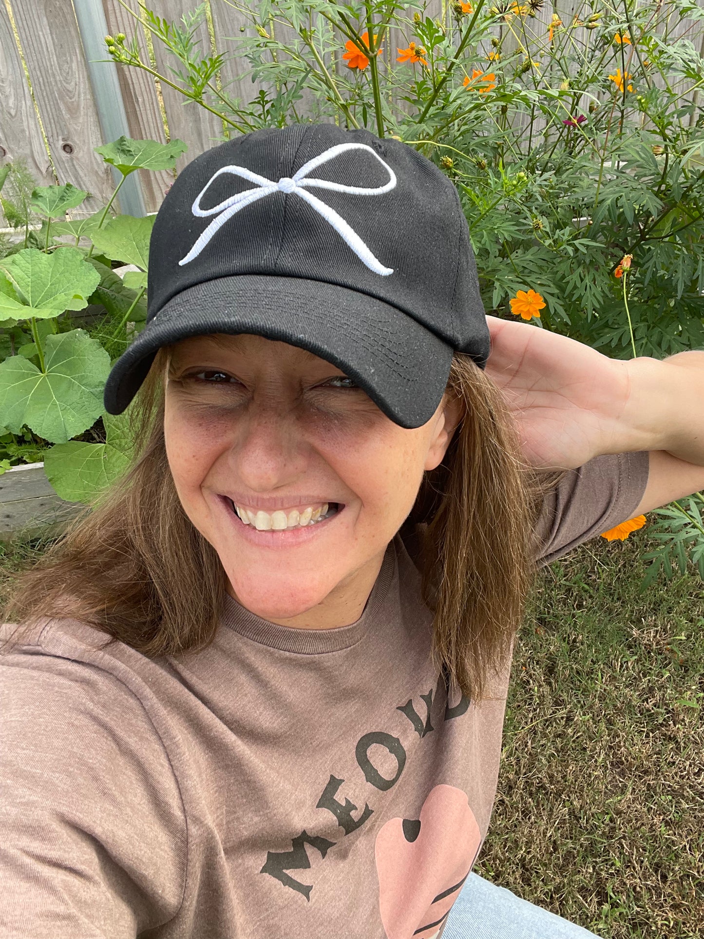 White Embroidered Coquette Bow on a Black Baseball Cap