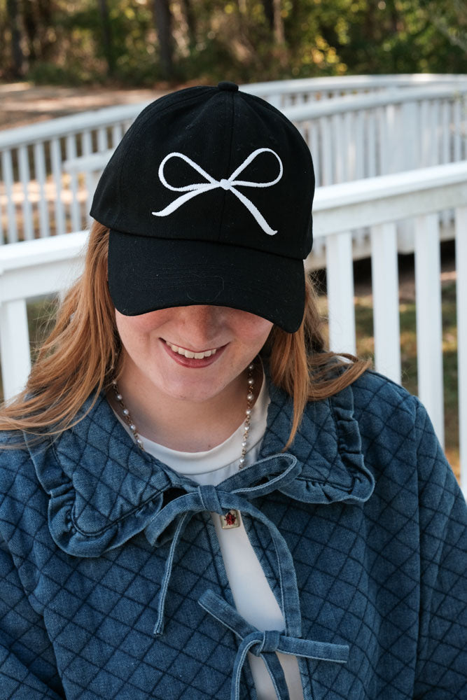 White Embroidered Coquette Bow on a Black Baseball Cap