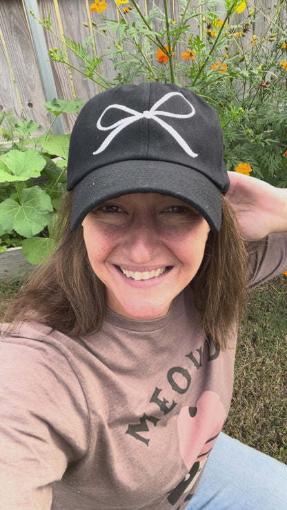 White Embroidered Coquette Bow on a Black Baseball Cap